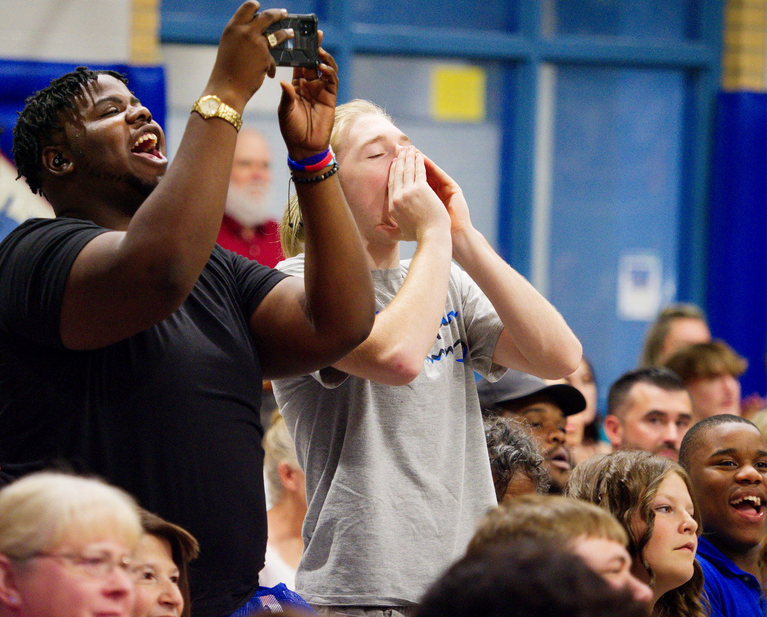 Audience members at Quitman graduation show their approval.